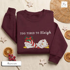 Too Tired to Sleigh | Jolly Goose on the Loose | Embroidered Unisex Heavy Blend™ Crewneck Sweatshirt